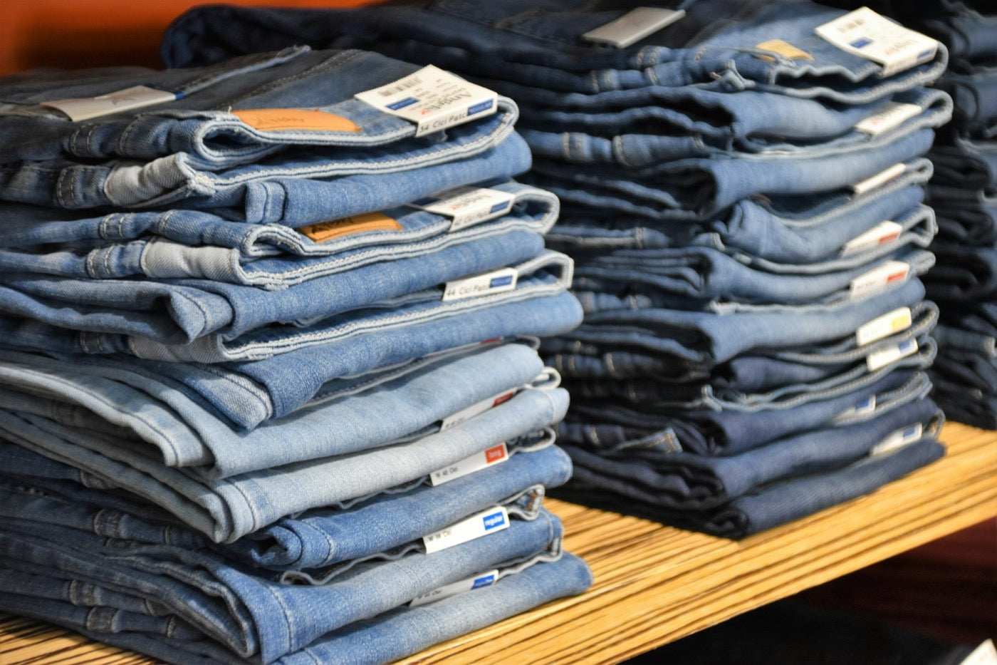 Stacks of folded denim jeans